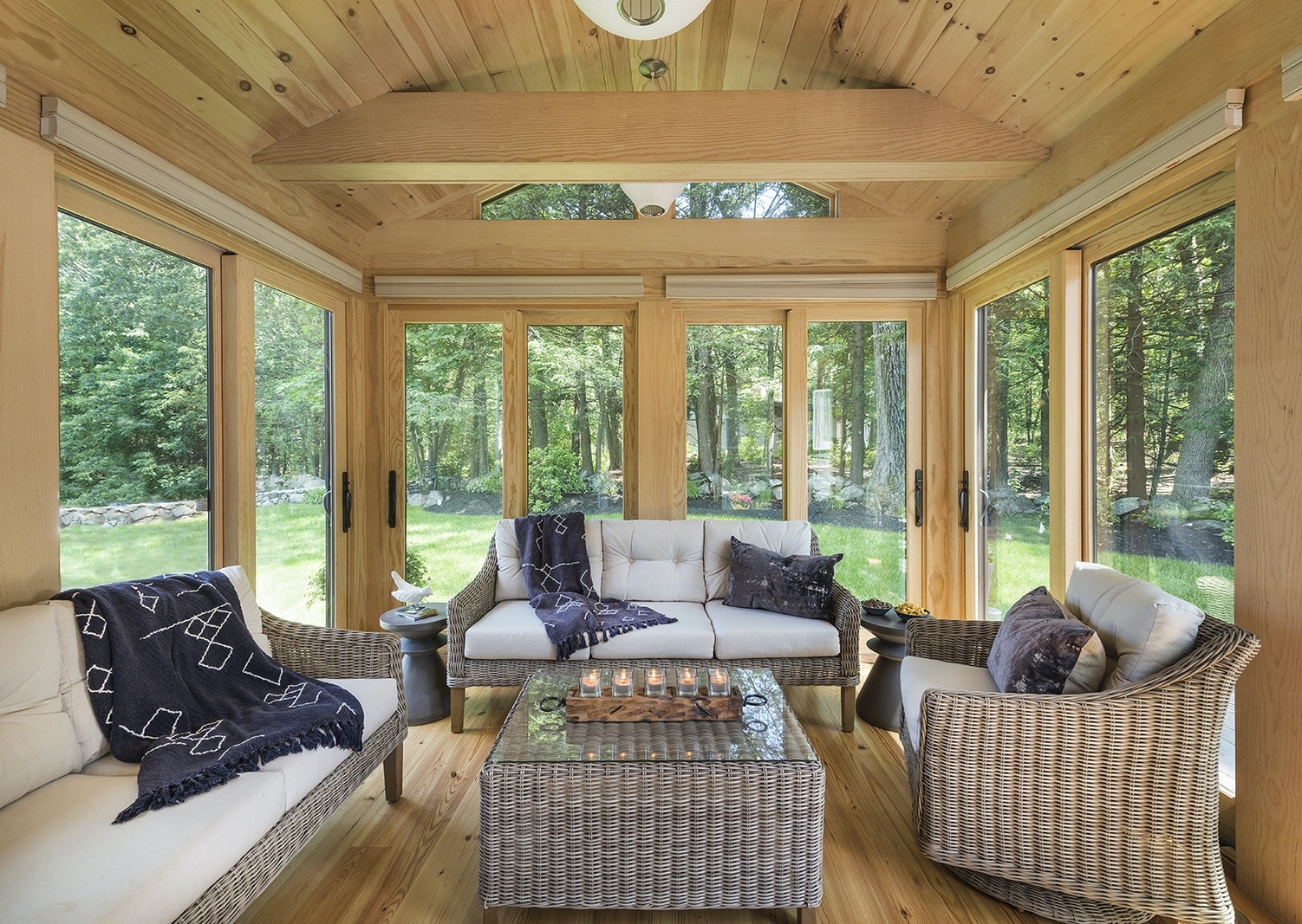 A Four-Season Sunroom Design with oak wood and pine floors