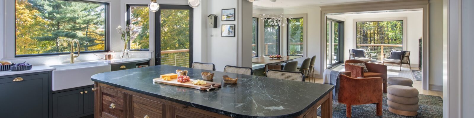 Kitchen island open to dining and living rooms | Whole-house Remodel in Concord, MA Remodeling by Feinmann
