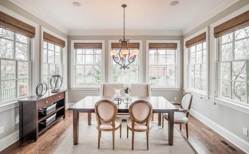 Sunroom modern design with blonde wood table and neutral color palette